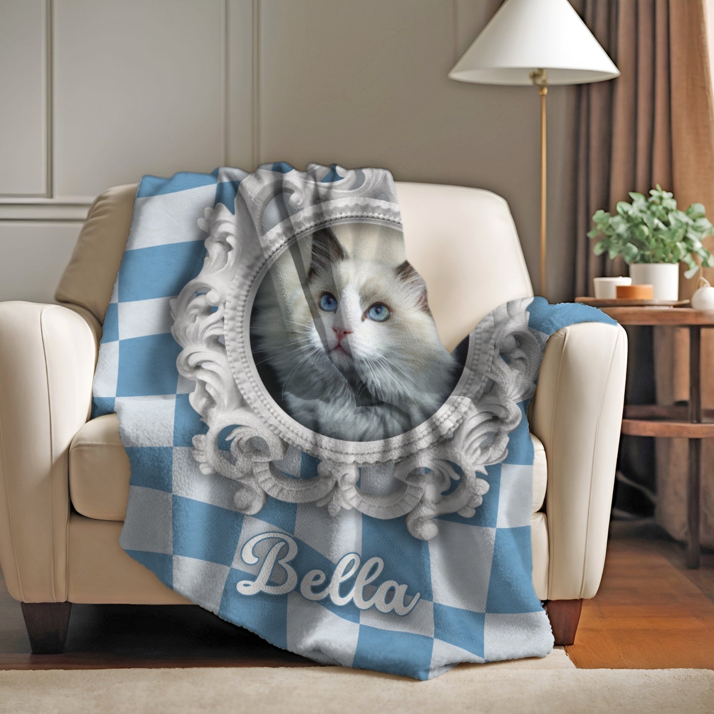 Blue and white checkered personalized cat blanket with elegant frame and name Bella, draped over cozy armchair in living room setting