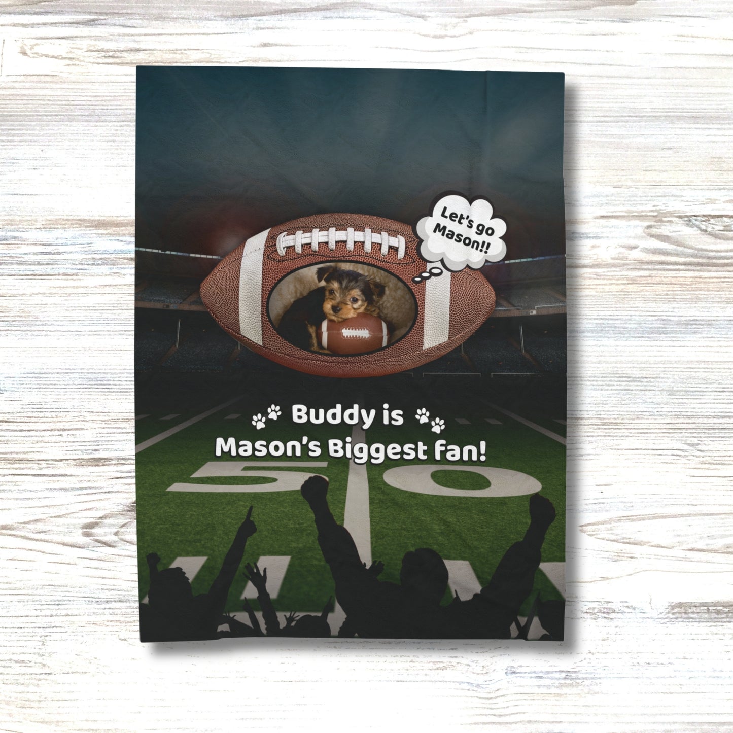 Custom pet football blanket with child’s name and pet photo shown on wood background – Buddy is Mason’s Biggest Fan design
