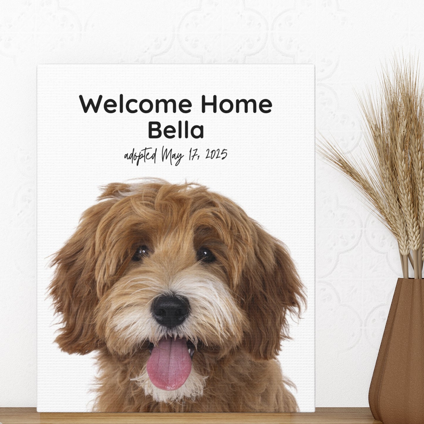 Personalized 8x10 dog adoption canvas print featuring a doodle named Bella, styled next to a terracotta vase with wheatgrass on a wooden shelf.