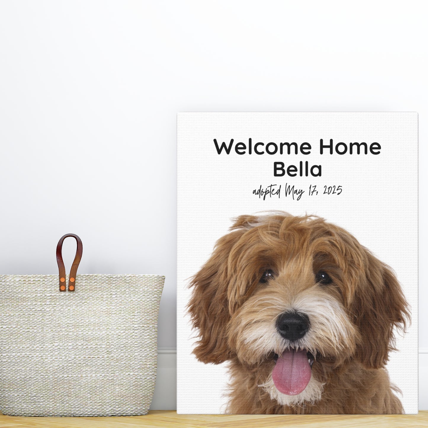 Personalized 8x10 dog adoption canvas featuring a doodle named Bella, displayed next to a woven tote bag on a light wood floor.