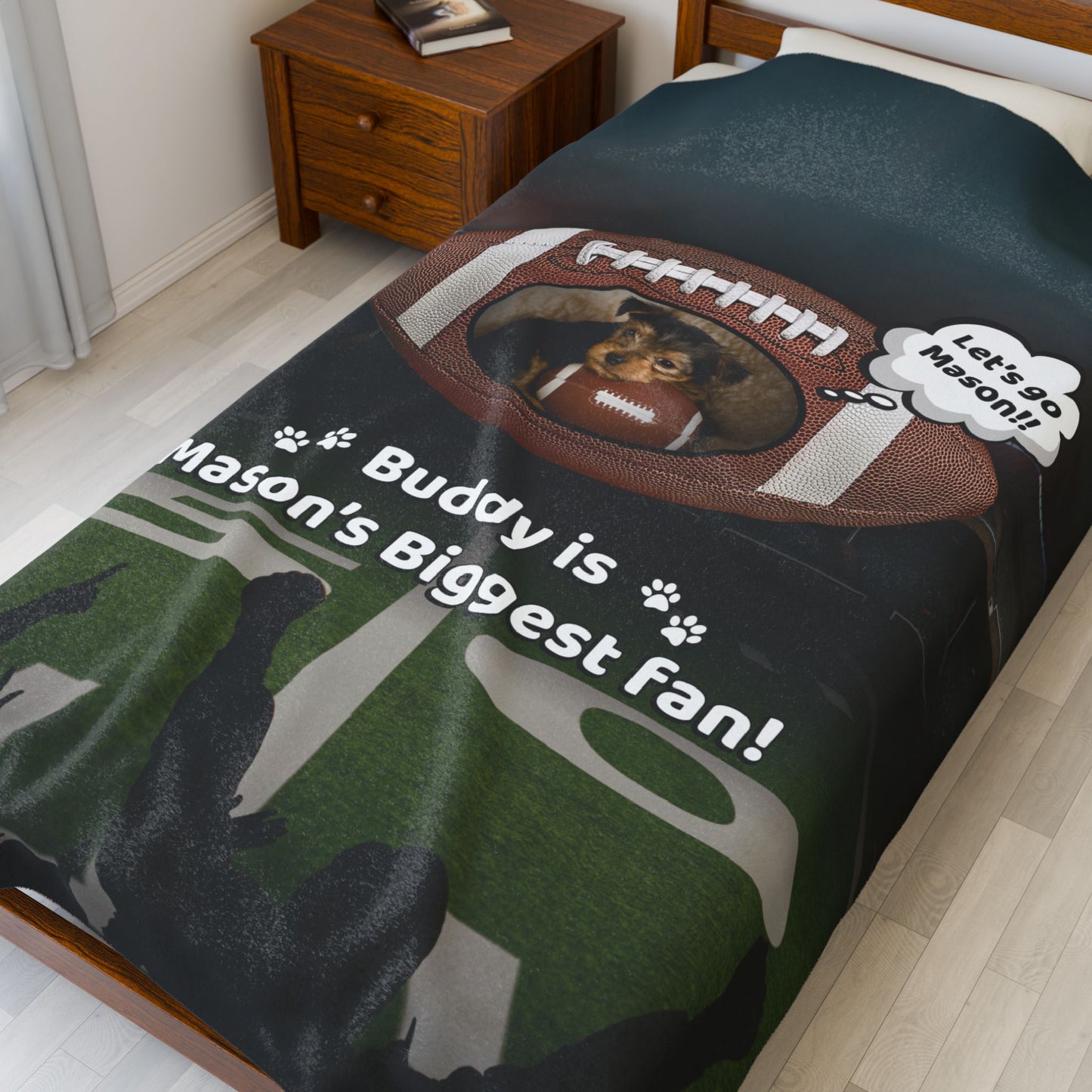 Football-themed personalized blanket shown on a twin bed, featuring a small dog holding a football with the phrase “Buddy is Mason’s Biggest Fan” — perfect for kids who play sports and love their pets