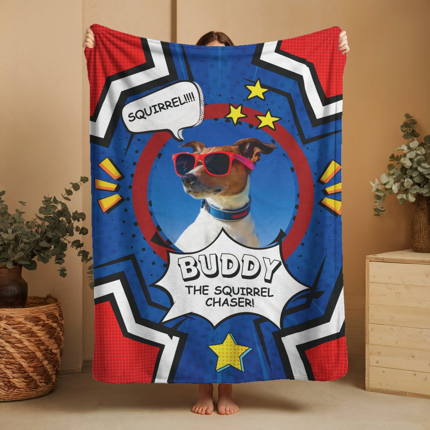 Comic-style personalized dog blanket featuring Buddy with red sunglasses and “Squirrel Chaser” speech bubble, held up in front of neutral background