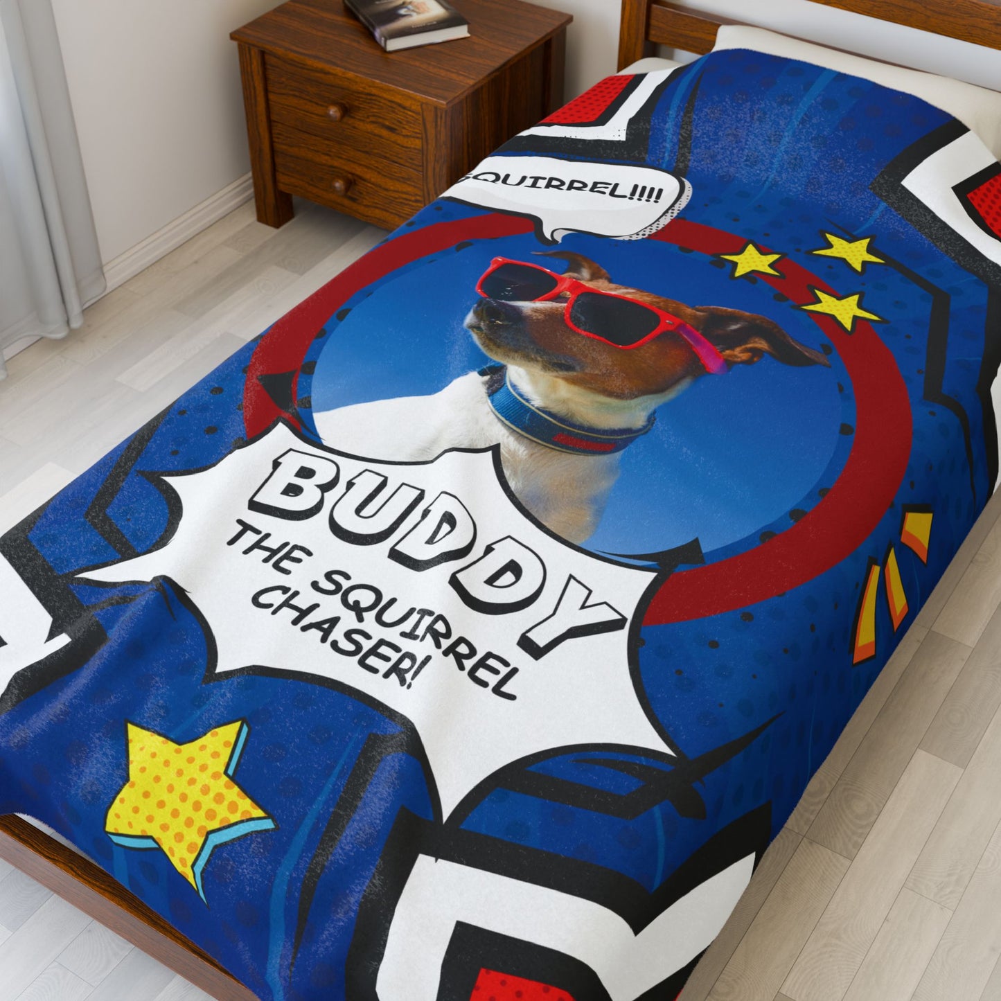Personalized comic-style dog blanket featuring Buddy with sunglasses and “Squirrel Chaser” text, shown on a made bed in a cozy bedroom setting