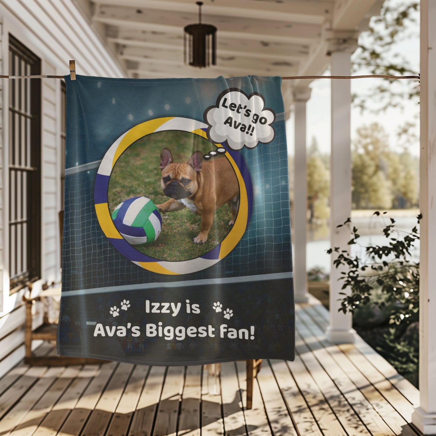 Personalized volleyball dog blanket featuring Izzy the French Bulldog, hanging on a farmhouse porch with natural lighting and scenic background.