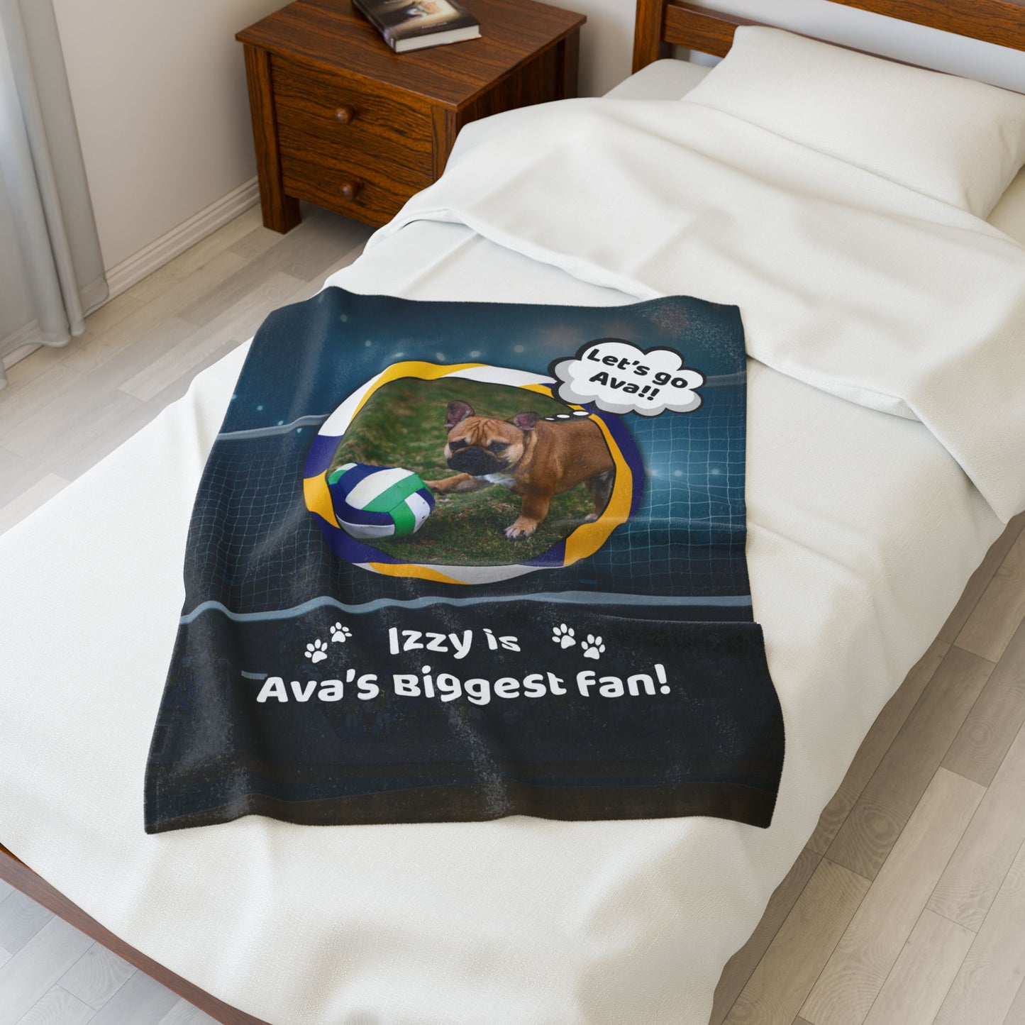 Small personalized volleyball blanket with Izzy the French Bulldog and custom name, displayed on a white twin bed.