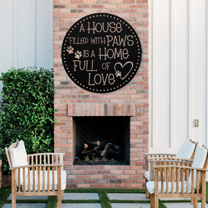 A House Filled with Paws is a Home Full of Love’ metal sign, durable 18-gauge steel wall decor for pet lovers, suitable for indoor or outdoor display. Shown in Black.