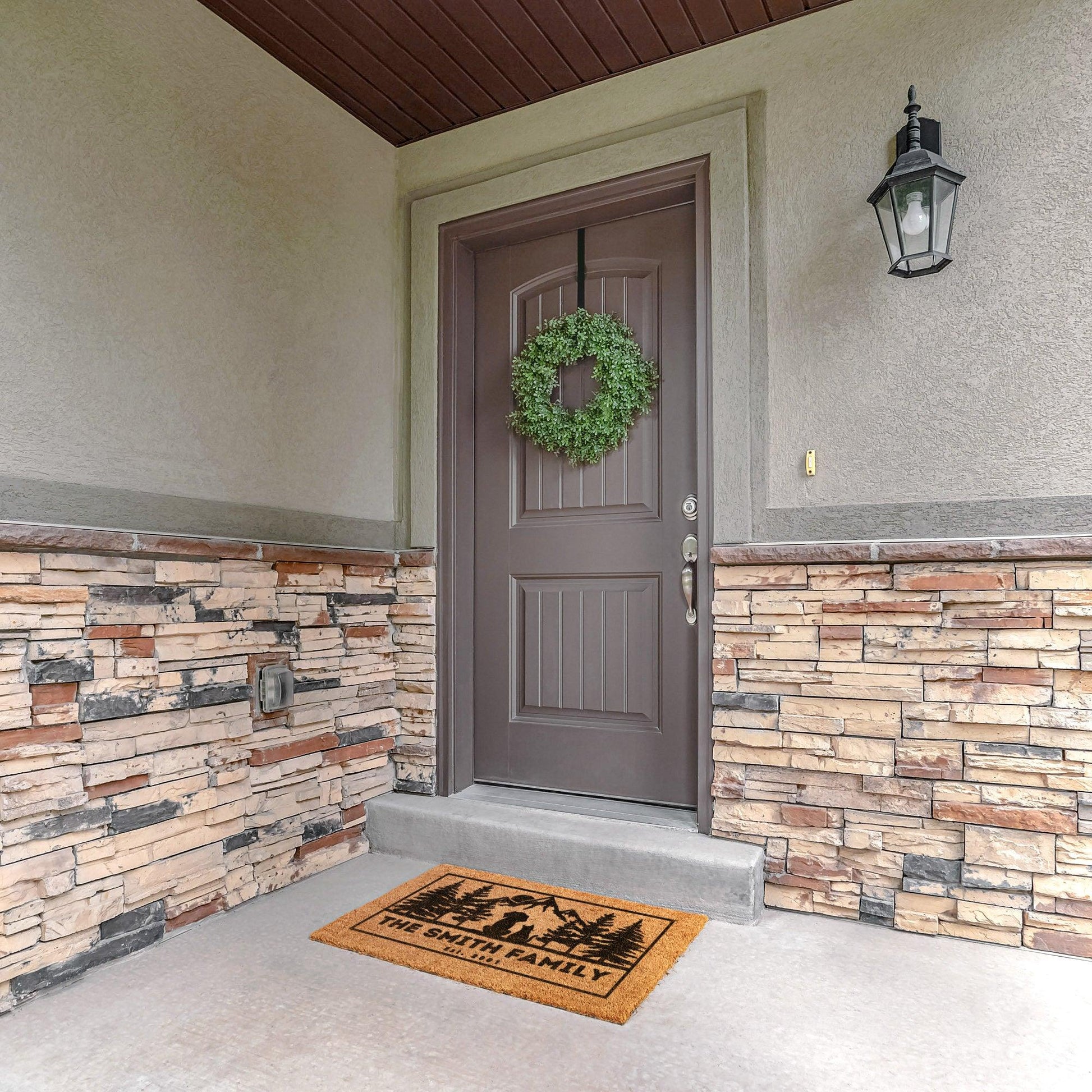 Dog and cat admire mountains customizable coir rug, personalized doormat with family name, durable and fade-resistant, ideal for pet-friendly entryways with a scenic mountain design.