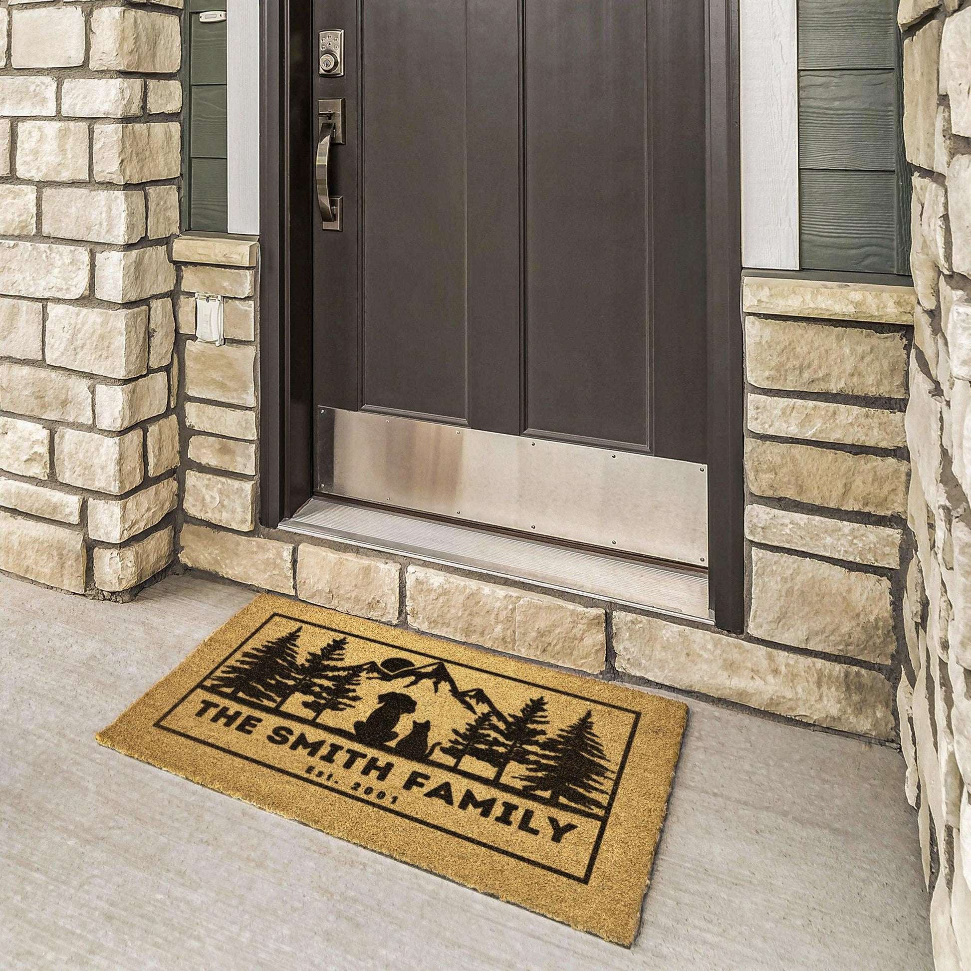 Dog and cat admire mountains customizable coir rug, personalized doormat with family name, durable and fade-resistant, ideal for pet-friendly entryways with a scenic mountain design.