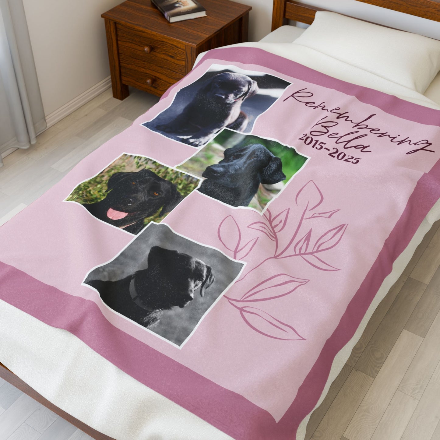 Personalized Dusty Rose pet memorial blanket on bed with four dog photos, remembrance dates, and soft pink floral line art