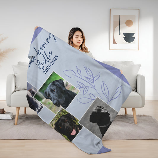 Woman holding Evening Lilac pet memorial blanket with four dog photos, remembrance dates, and a floral outline design
