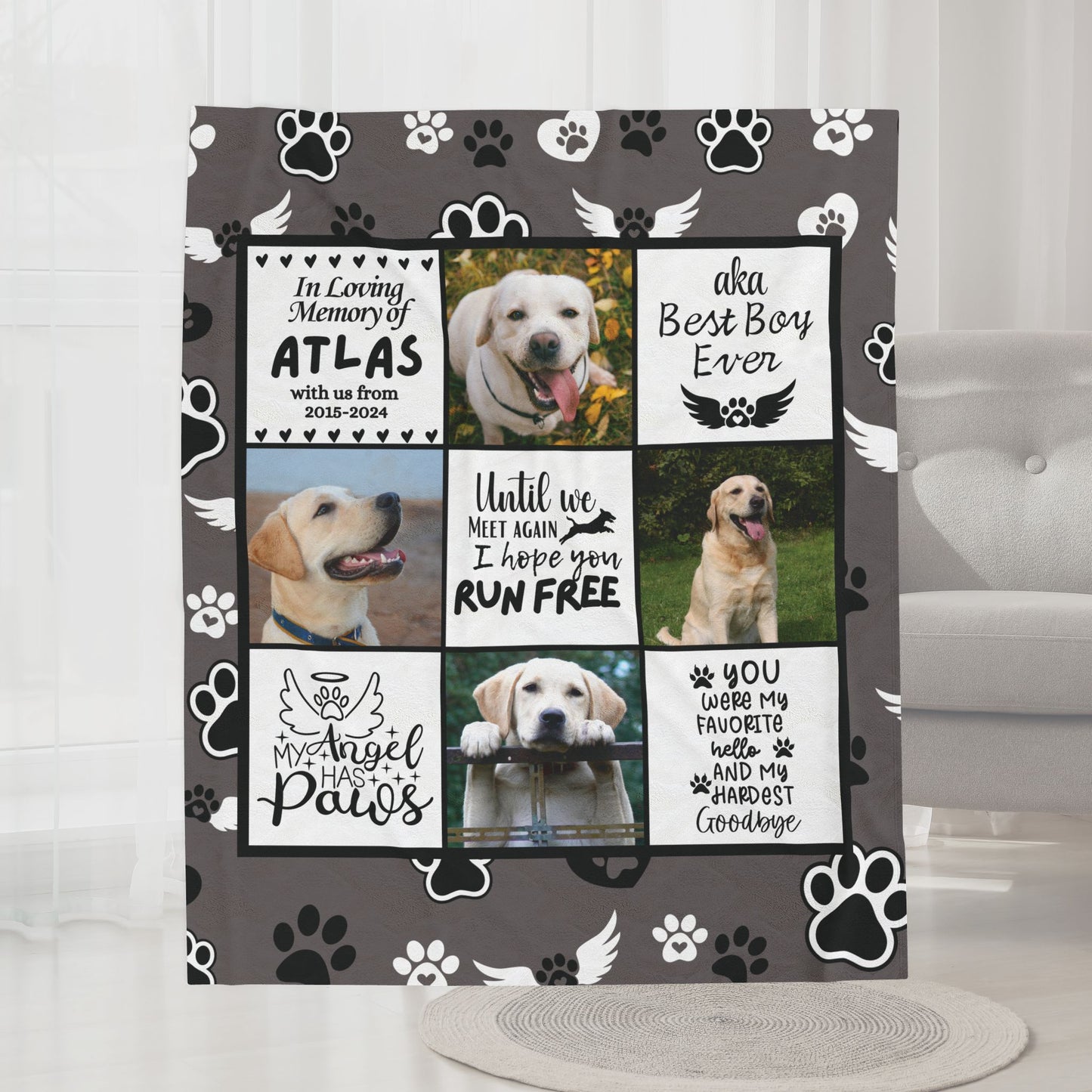 Personalized dog memorial blanket with photos and tribute quotes, displayed in a cozy gray living room with neutral decor and armchair. Fleece blanket features angel paw design and custom pet name.