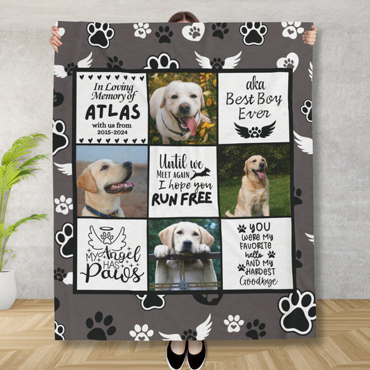 Woman holding personalized dog memorial blanket with photo collage, tribute messages, and angel paw background. Charcoal fleece throw in remembrance of a beloved pet.