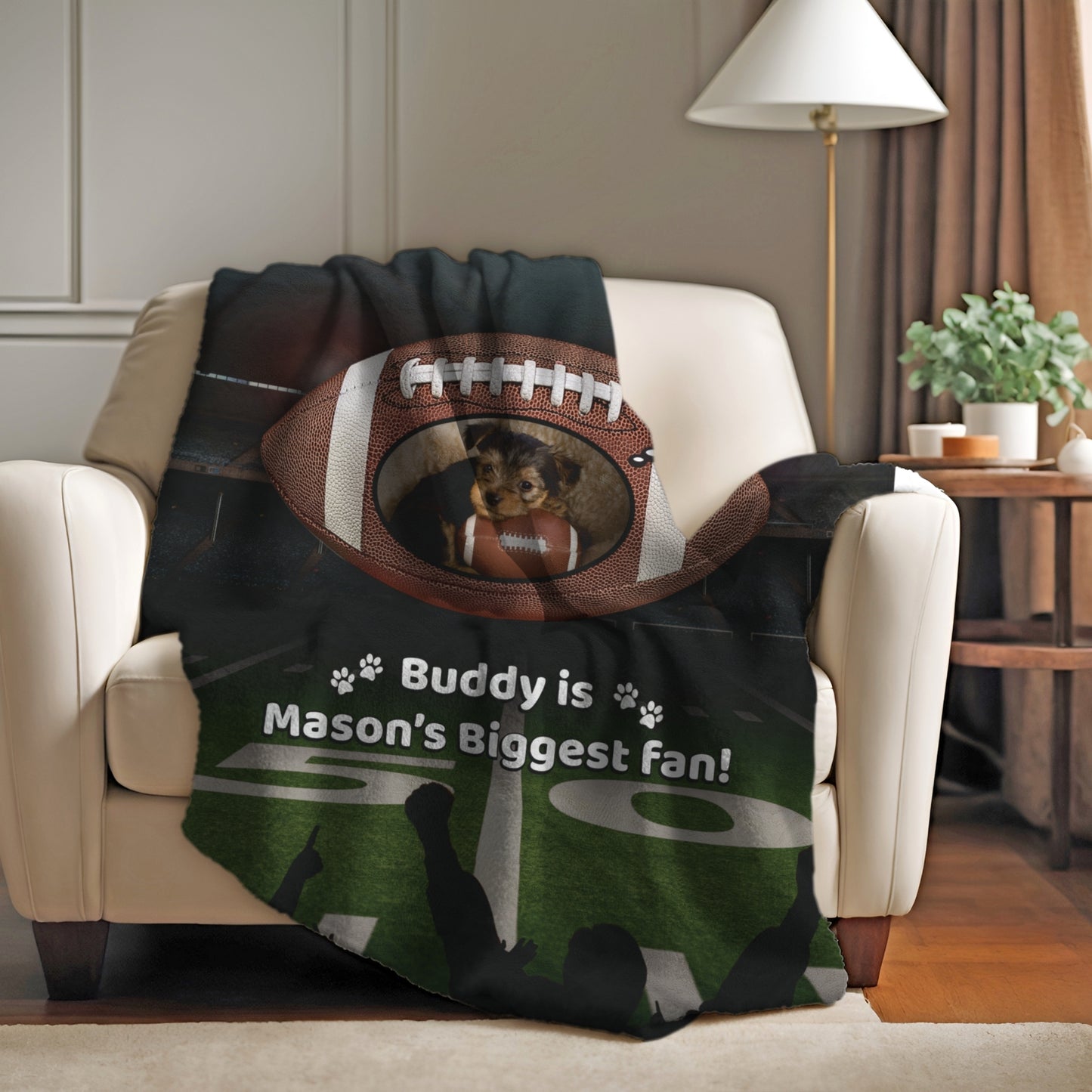 Football-themed personalized blanket draped over an armchair, showing a dog inside a football design with the phrase “Buddy is Mason’s Biggest Fan” — perfect for sports nights and pet-loving families
