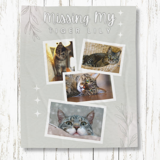 Flat lay of personalized cat memorial blanket with “Missing My Tiger Lily” text and four tabby cat photos, soft gray fleece tribute for grieving pet owners
