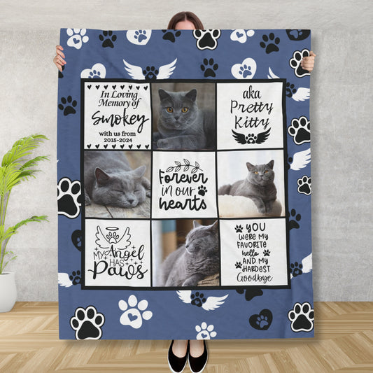 Woman holding a personalized cat memorial blanket featuring photos, name, dates, and remembrance messages for a pet named Smokey