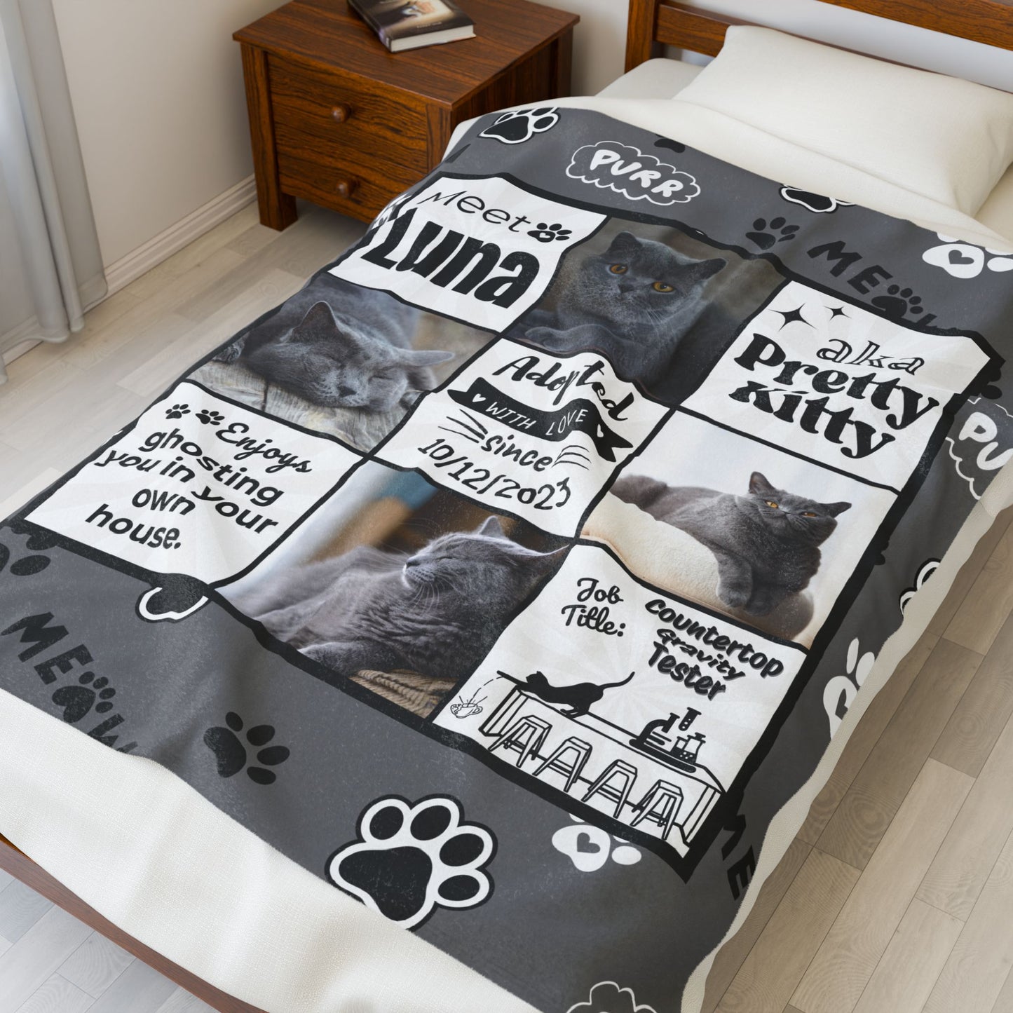 Personalized gray cat photo blanket displayed on bed, featuring Luna with adoption date, “ghosting you in your own house” phrase, and job title “Countertop Gravity Tester”