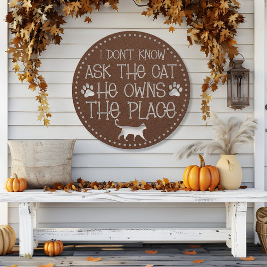 I Don’t Know, Ask the Cat, He Owns the Place’ customizable metal sign, pet-themed wall decor for cat lovers, durable 18-gauge steel in five colors, perfect for indoor or outdoor use. Shown in Copper.