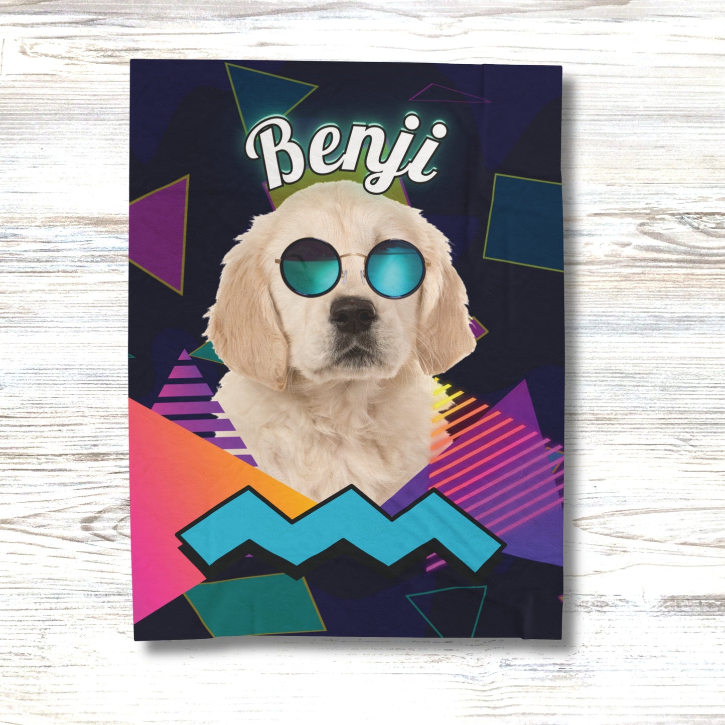 Personalized retro-style dog blanket with Benji wearing sunglasses, displayed on light wood surface with colorful neon geometric background