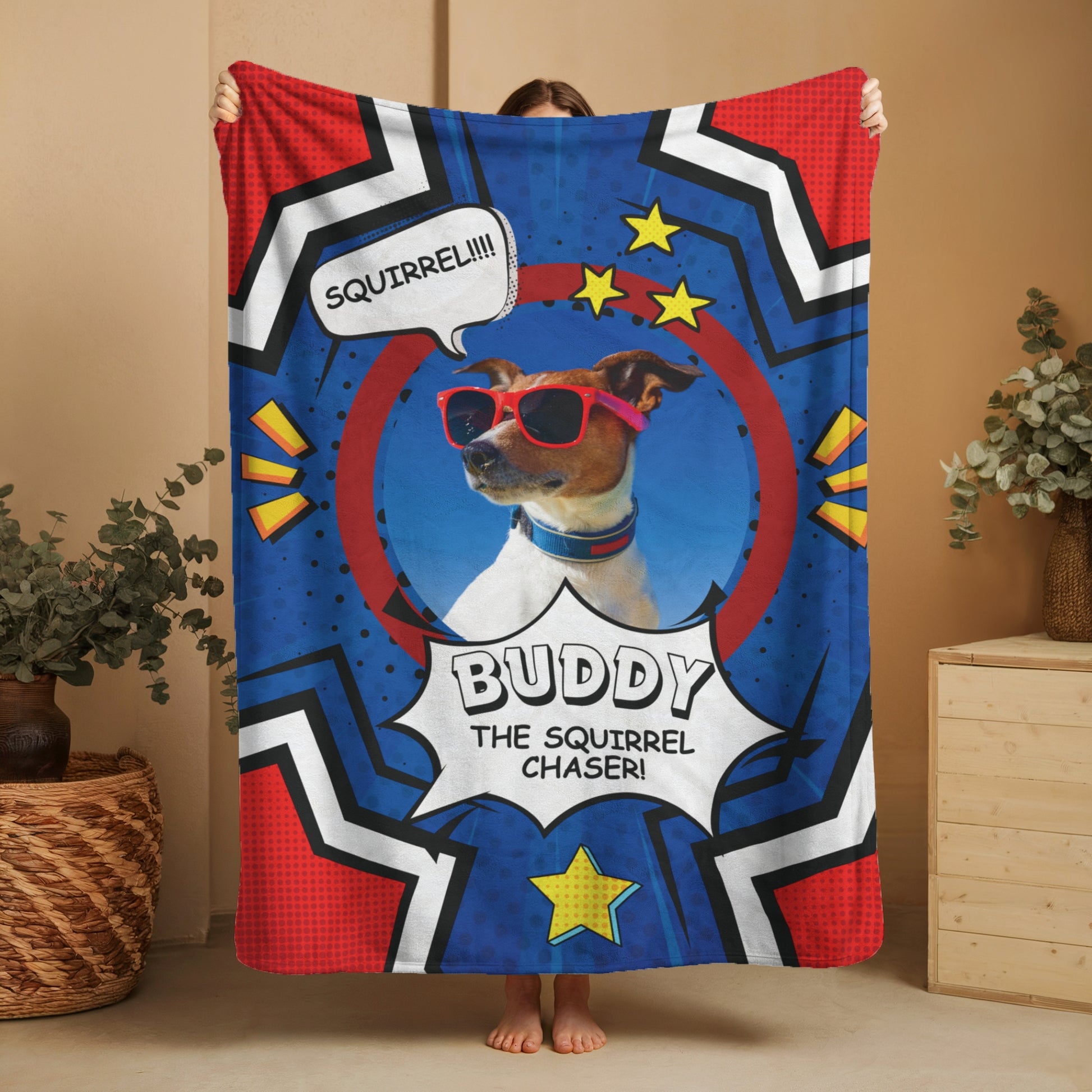 Comic-style personalized dog blanket featuring Buddy with red sunglasses and “Squirrel Chaser” speech bubble, held up in front of neutral background
