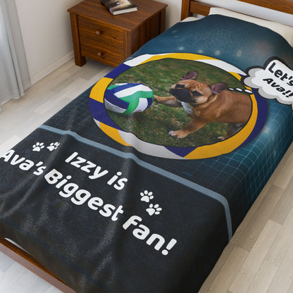 Large personalized volleyball dog blanket featuring Izzy the French Bulldog, styled on a neatly made bed with wood furniture.